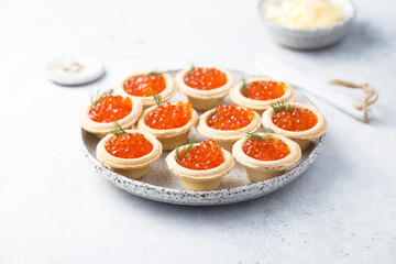 Red caviar served in tartlets