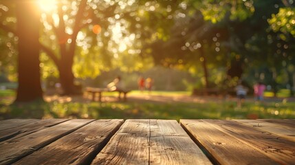 Naklejka na ściany i meble Wooden Table in a Park in Golden Hour with Children Playing on the Background