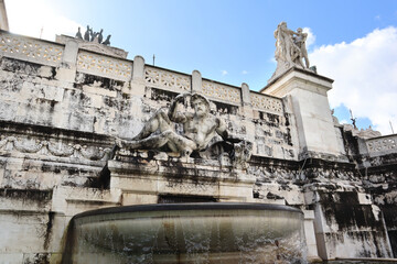 Fototapeta na wymiar Adriatic fountain of National Monument the Vittoriano at Venezia square in Rome, Italy 