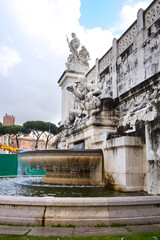 Fototapeta na wymiar Adriatic fountain of National Monument the Vittoriano at Venezia square in Rome, Italy