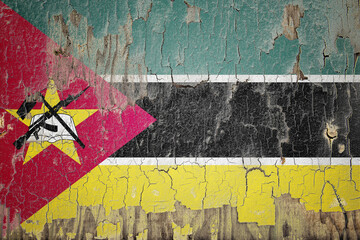 Mozambique flag painted on the cracked wall