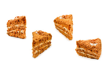 Peace of honey cake isolated on white background.