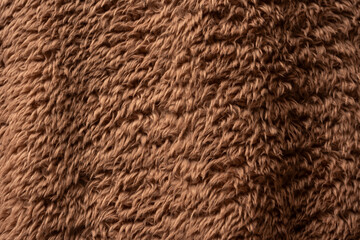 Texture of a brown faux fur as a background.