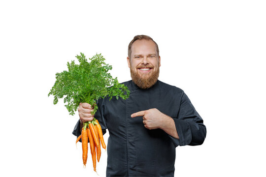  Friendly chef cook holds a big bunch of carrots isolated on free PNG background.
