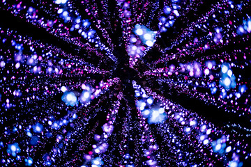 Celebration lights at Christmas New Year festival. Crowd of hanging blue light bulbs blue bokeh background. blue light bulb tunnel. 