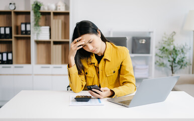 woman work late from home in room at late night overtime.Businesswoman bending over workplace in...