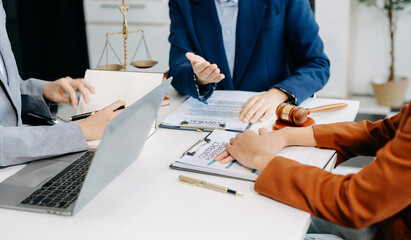 Two lawyers are discussing about contract paper, law matters determination, pointing.law and hammer...