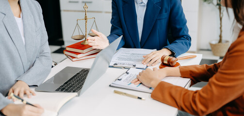 Two lawyers are discussing about contract paper, law matters determination, pointing.law and hammer...