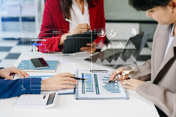 Business team Project manager working and update tasks and Gantt chart scheduling virtual diagram.with smart phone, tablet and laptop in office.