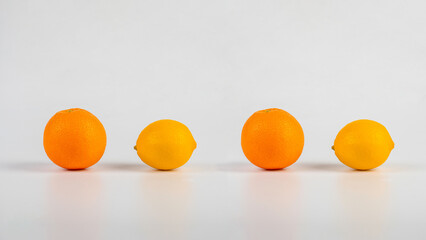 One lemon and orange fruit isolated on white background.