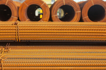 Stacked packs of stored rusty fittings in a warehouse.