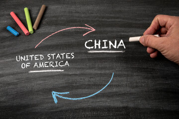 United States of America and China. Black scratched textured chalkboard background