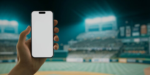 A hand holds a smartphone with a green screen at a baseball stadium - 757093854