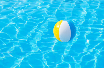 Colorful inflatable ball floating in swimming pool - 757101883