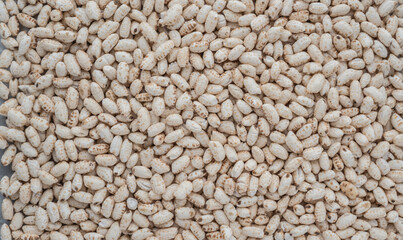 grains of japanese puffed rice in full screen . puffed rice with sugar in full frame. 