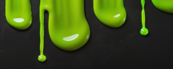 Viscous Green Fluid. Flowing Vertically in Smooth, Wavy Drips on a Black Surface - obrazy, fototapety, plakaty