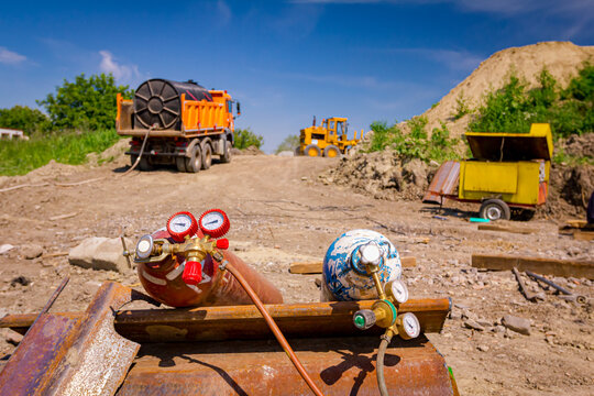 Metal gas acetylene cylinder containers with oxygen and nitrogen placed on the construction site