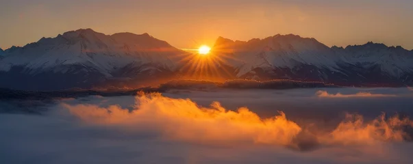 Papier Peint photo Orange Golden Sunrise. Snow-Covered Mountains and Misty Valleys Awaken to the Warmth of Dawn