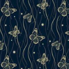 Golden butterflies in a pattern.Vector seamless pattern with gold decor and butterflies on a blue background.