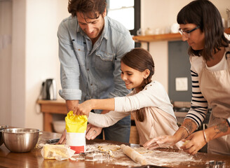 Mother, father and girl with flour for cooking in kitchen with dough, happiness and teaching with...