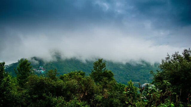 4K Timelapse video of Beautiful Green Mountains and clouds of Bhimtal in the district of Nanital, Uttarakhand. The beauty of nature on the hills of Bhimtal Uttrakhand.

