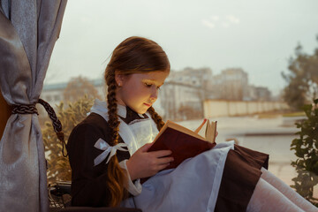 Girl in a vintage uniform reading, bathed in soft window light.