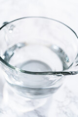 Measuring Glass Cups Filled with Water for Preparation