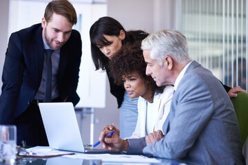 Business, coaching or discussion with diversity, laptop and technology in office. Businessman,...