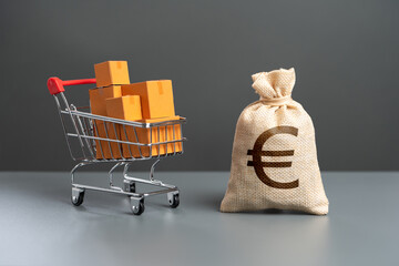 Shopping cart with boxes of goods and euro money bag. Purchasing power of buyers. Trade and retail....