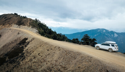 Driving off road car in high altitude mountains in tibet, China