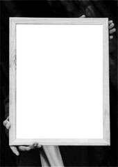 Halftone image of hands holding a portrait  picture frame with a transparent 