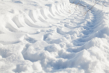 Wheel tracks on the snow.