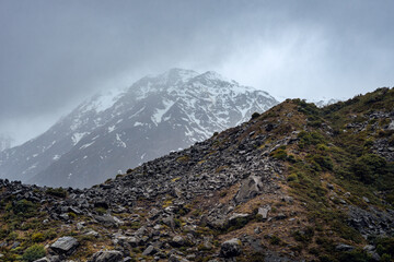 View of rainy hike to Kea Point lookout, Mount Cook National Park, New Zealand. Dramatic landscape,...