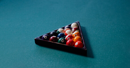 Billiard balls in the triangle on the snooker table.