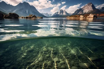 Photo sur Plexiglas Europe du nord a rocky shore and mountains under water