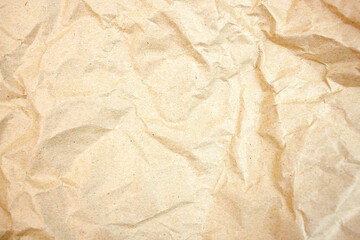 Crumpled brown paper, background. Authentic crumpled, crumpled wrapping paper, cardboard.