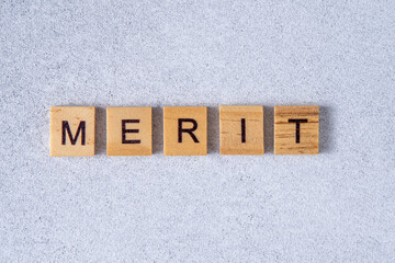 Merit word made of wooden letters.