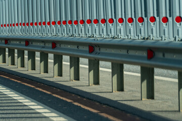 Safety barriers on highway. Anodized safety steel barrier. Enhancing highway safety.