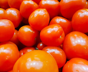 Red tomatoes, background. Natural, fresh tomatoes, market, harvest.