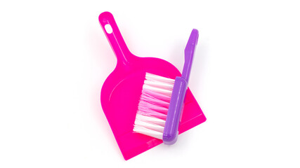 Plastic toy broom and scoop isolated on white background