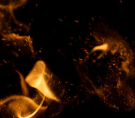 fire flame with sparks on black background.