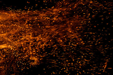 fire flame with sparks on black background.