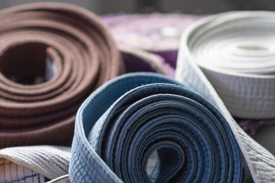 Martial arts belts progression copy space background image, selective focus training jiujitsu martial arts theme