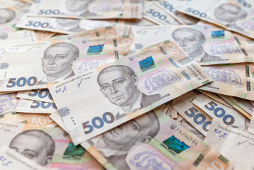 Obraz na płótnie Canvas 500 hryvnia banknotes on the table. Big sum of money, cash on the table, ukrainian hryvnias