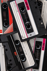 Close-up of many audio tapes. Analog storage medium. Cassettes for audio recordings and music....