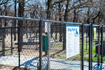 Gate entrance public dog park secured with galvanized vinyl-coated chain link fences, steel posts...