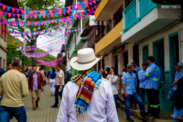 Peasant with hat and poncho walks through the streets of the town of Jerico, Colombia - obrazy, fototapety, plakaty