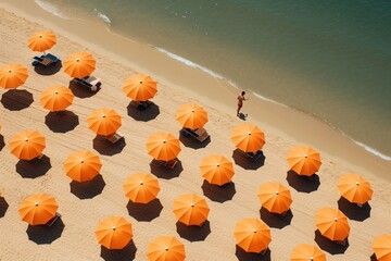 a group of orange umbrellas on a beach