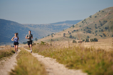 Obraz premium Energized by the beauty of nature, a couple powers through their morning run, their bodies and spirits invigorated.