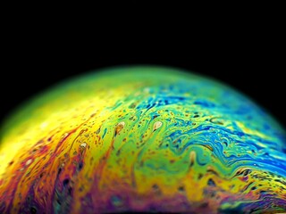 The beauty of the colorful artificial planet made from macro photography of soap bubbles